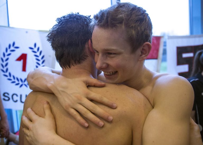 SCUW's Artur SCHNEIDER (R) of Switzerland hugs his teammate Sven PFEUTI after he competed in the men's 100m Freestyle during the NLA Swiss Swimming Club Championships at the Hallenbad Buchholz in Uster, Switzerland, Sunday, March 24, 2013. (Photo by Patrick B. Kraemer / MAGICPBK)